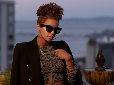 Trendy woman taking a call with Bose Soprano style frames